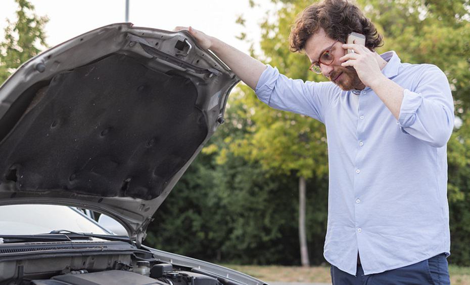 Man Calling Mechanic Service After Vehicle Problem